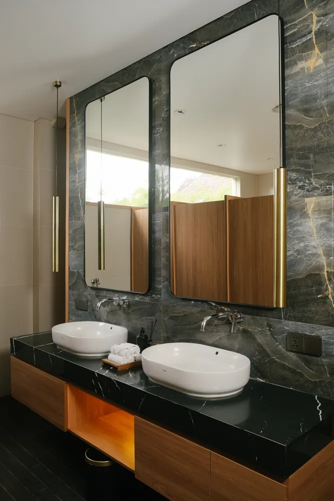 Changing room vanity with twin basins and mirrors