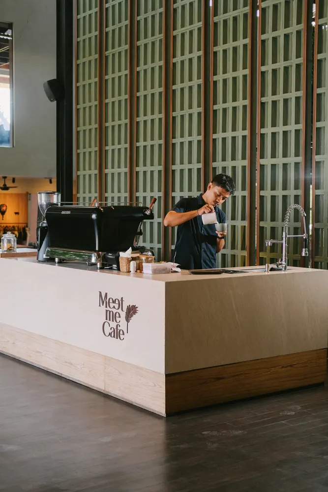The Meet me Cafe bar, with a barista at work